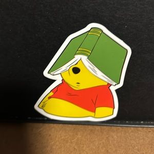 POOH BEAR WITH BOOK ON HIS HEAD STICKER